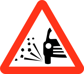 Traffic sign of Bangladesh: Warning for loose chippings on the road surface